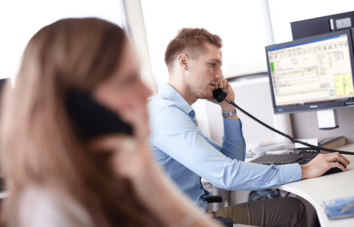 Image of a broker on the phone talking to a client