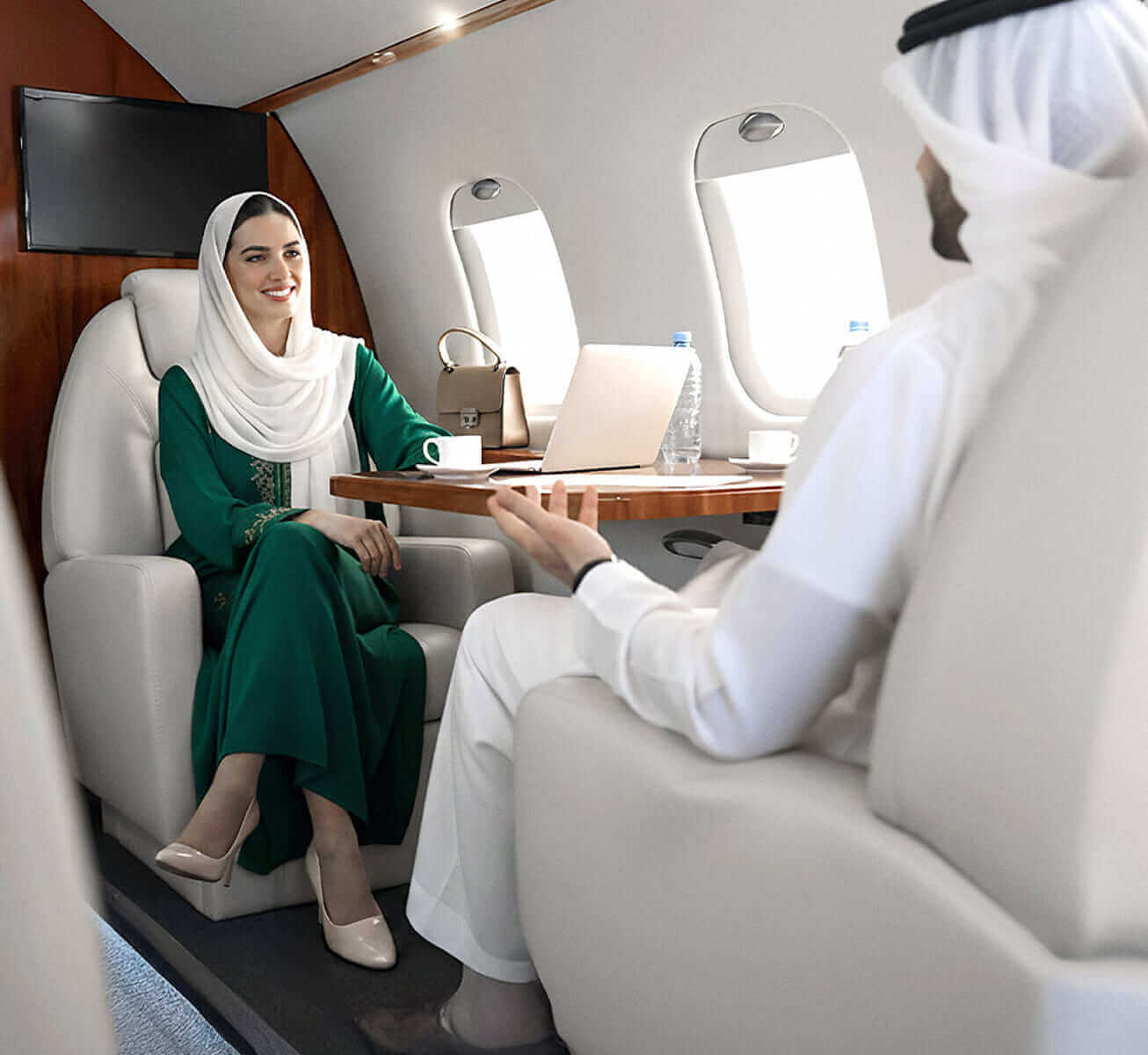 Business leaders boarding a private jet at a UAE airport