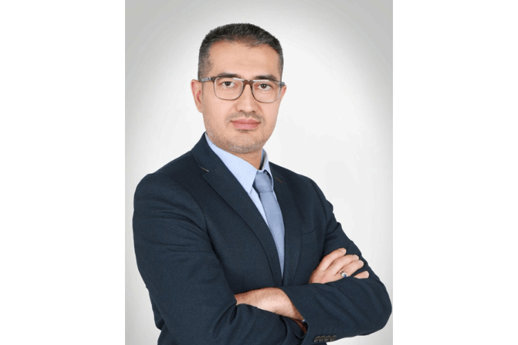 A headshot of Tohir Choriev