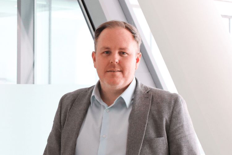 A headshot of Andy Hutchinson