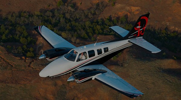 Beechcraft private jet over land