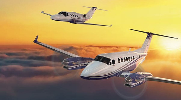 Cessna jets against a yellow sunset sky