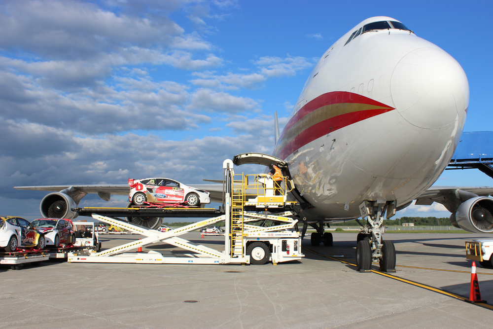 rallycross car loading on cargo aircraft