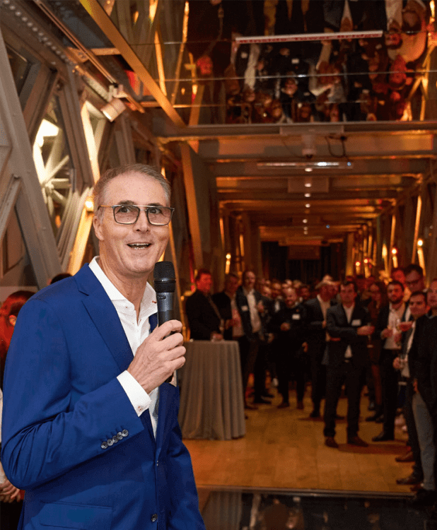 Eric Erchaber at Chapman Freeborn celebrating 50 years at tower bridge