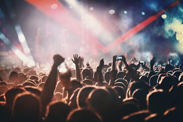 Band on stage performing at festival in front of audience
