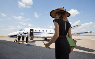 Lady with luggage walking onto a private jet