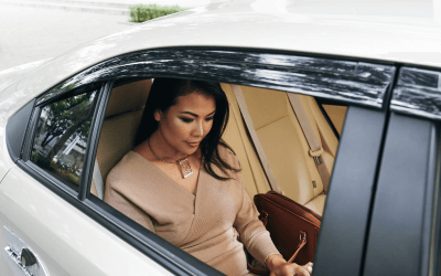 Lady in a car driving to a private terminal