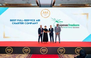 Chapman Freeborn team receiving the Best Full-Service Air Charter Company award at the AAA ceremony, showcasing excellence in air cargo charters for the oil and gas industry