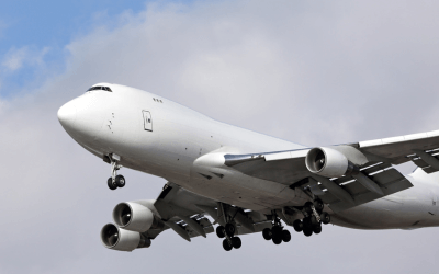 Airplane Flying in Cloudy Sky: Timely Summer Delivery with Air Charter