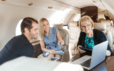 Confident business professionals network and socialize at a corporate event, during successful group air charter to international event.