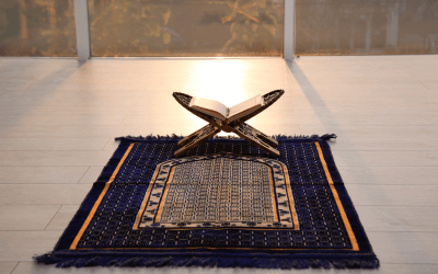 indian groom with a prayer mat at a wedding in the middle east, group air travel for middle eastern wedding attendees