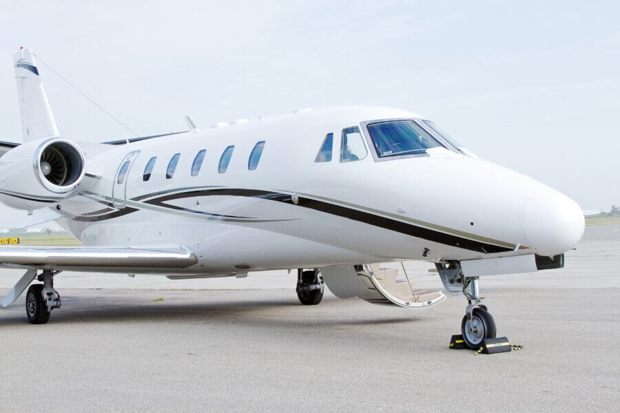 Close-up of private jet windows at luxury APAC airport