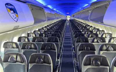 Interior of an Airbus A320 cabin featuring the Pafos FC team logo.
